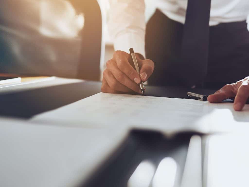 image of an Injury Lawyer Peoria IL working on paperwork